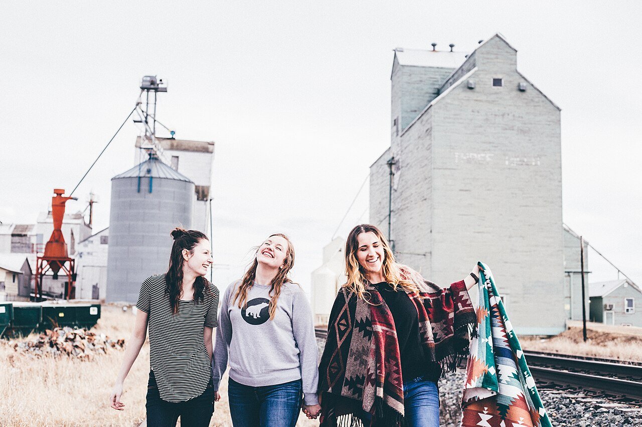 Three friends by the tracks, photographed by Priscilla Du Preez